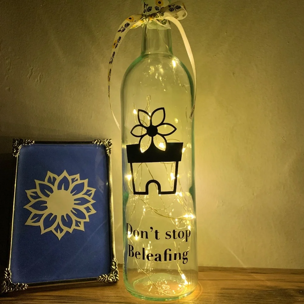 ‘Don’t Stop Beleafing’ logo wine bottle lantern